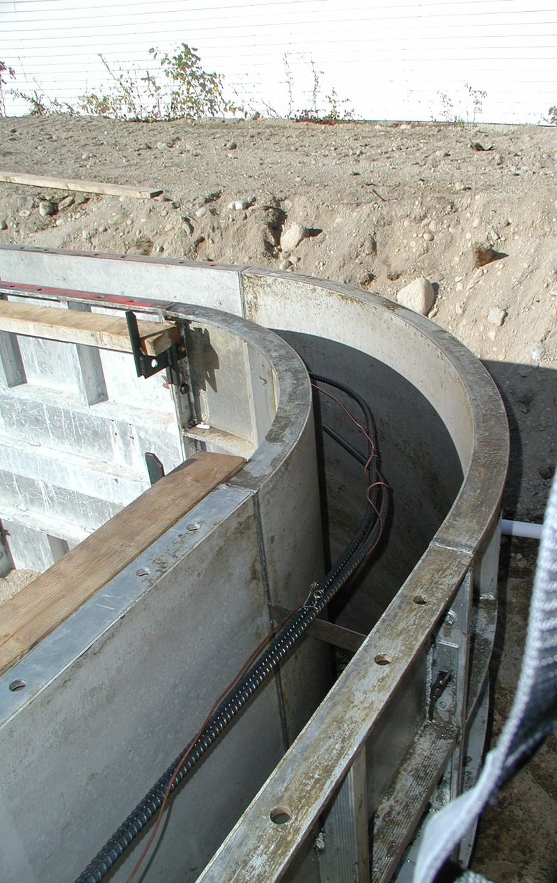 Two-foot radius corner forms set in a pool wall on a jobsite