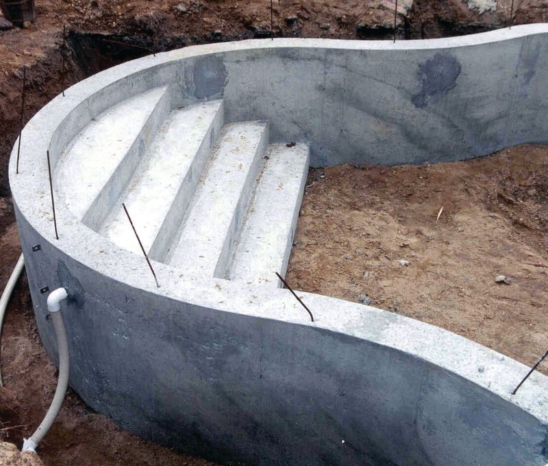 Poured concrete radius steps after the forms have been stripped
