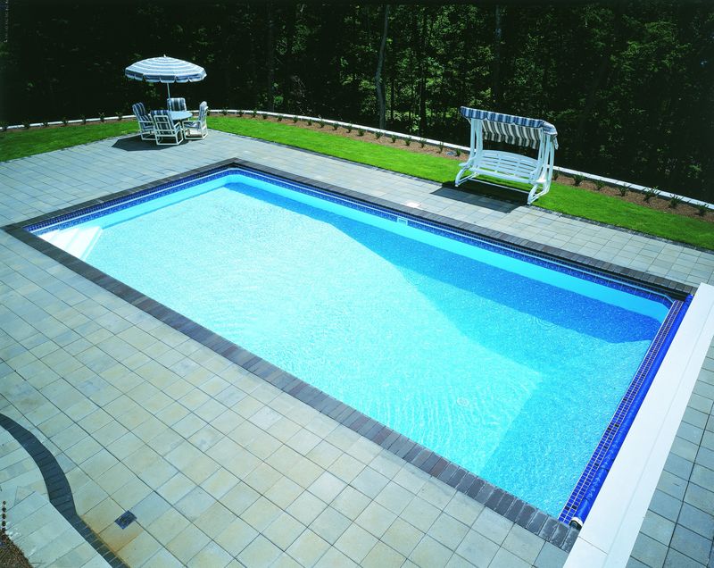 Finished rectangular pool with a tile deck