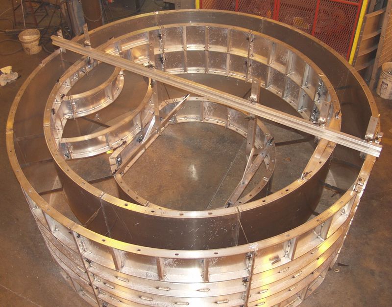 Round aluminum spa forms assembled on the shop floor
