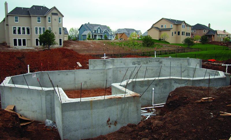 Concrete pool walls after the aluminum forms have been stripped